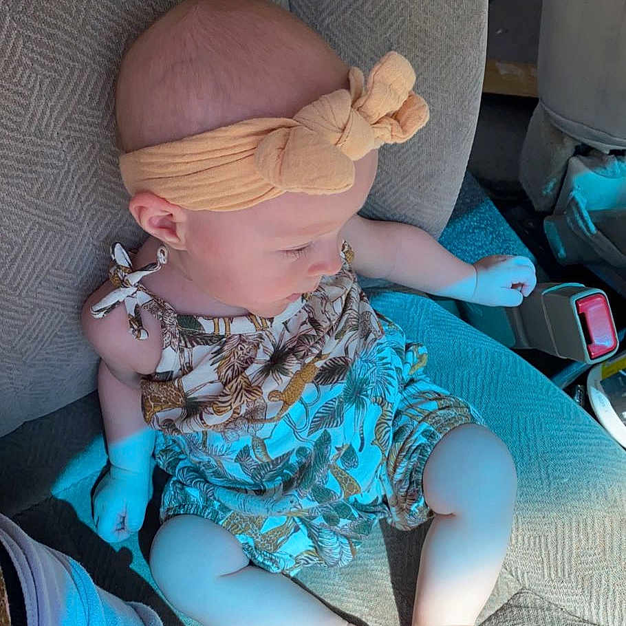 Amber is registered to the contest to win money with this photo: baby, baby_toddler_clothing, blond, chair, child, comfort, doll, electric_blue, fashion_design, human_leg, joint, knee, lap, leg, pattern, pink, purple, sitting, sunglasses, thigh