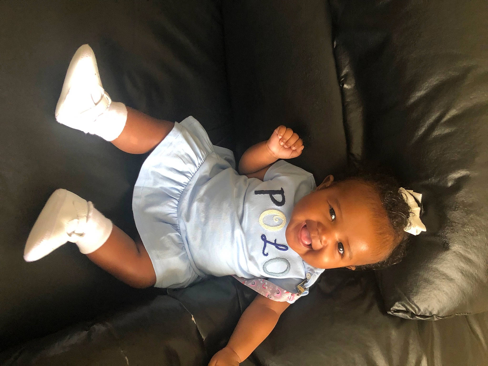 Alana Grace joined the competition — help win amazing prizes! arm, baby, baby_toddler_clothing, comfort, elbow, event, finger, flash_photography, fun, gesture, happy, hat, human_leg, joy, knee, person, sitting, sleeve, smile, t_shirt