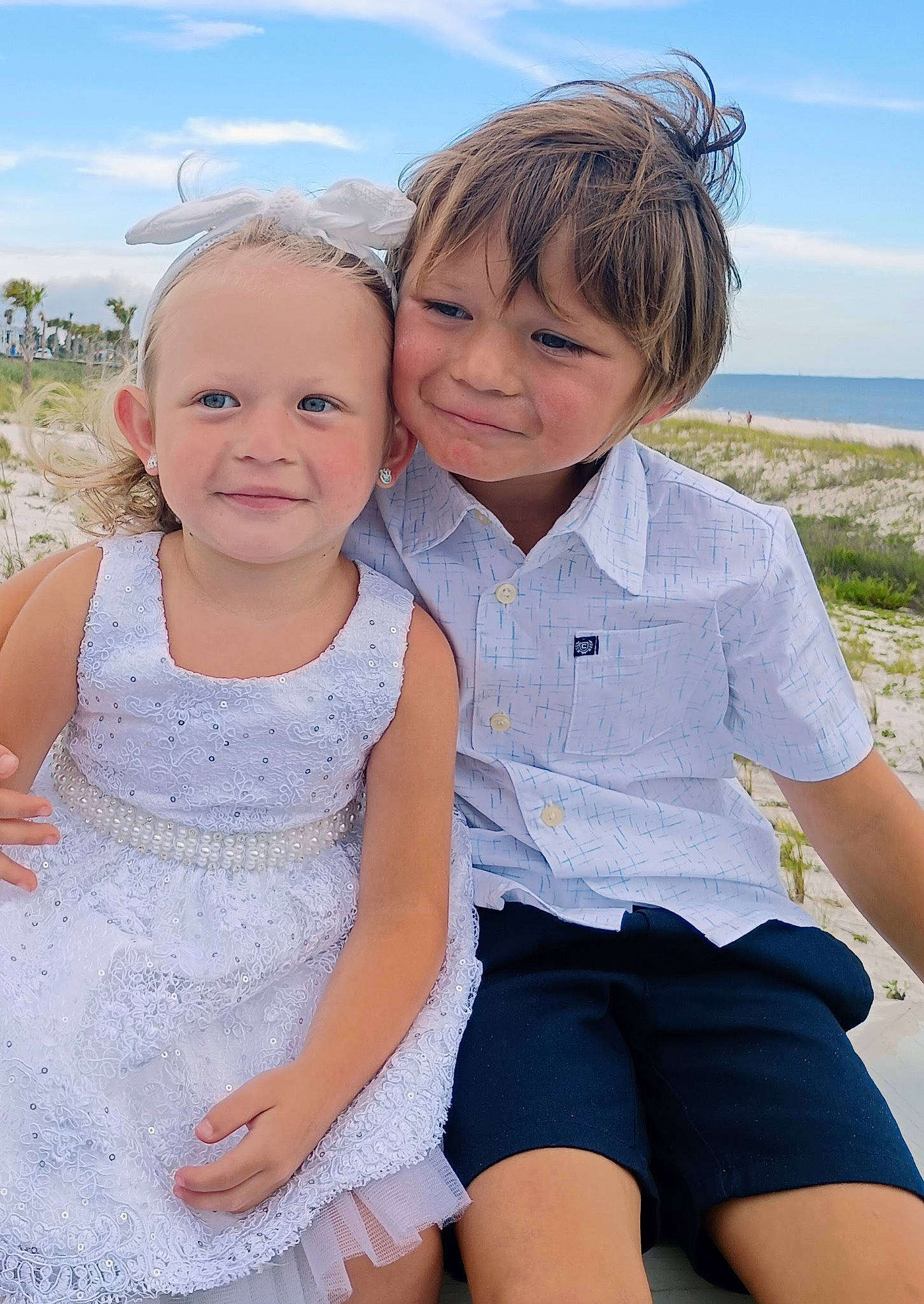Callie is registered to the contest to win money with this photo: clothing, cloud, dress, face, friendship, fun, gesture, grass, happy, human, human_body, interaction, iris, joy, people_in_nature, person, plant, skin, sky, smile