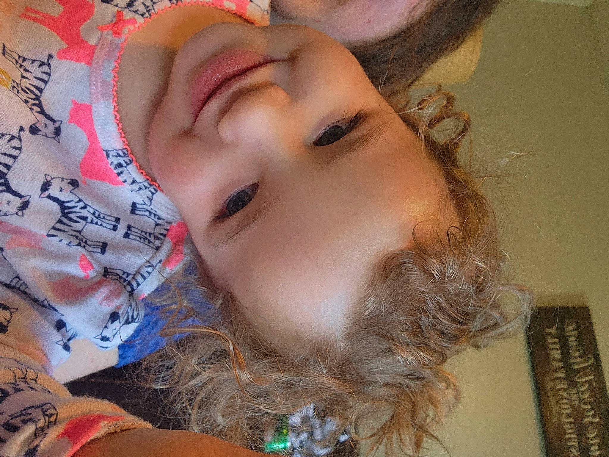 Charlotte is registered to the contest to win money with this photo: bangs, black_hair, blond, cheek, child, chin, ear, eyebrow, eyelash, finger, forehead, happy, iris, jaw, joy, lip, mouth, neck, nose, person