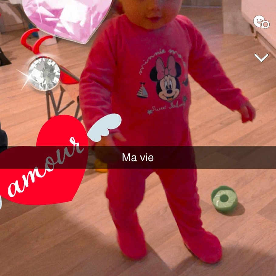 Maïna participe au concours pour gagner de l'argent avec cette photo : advertisement, baby, book, clothing, doll, face, hardwood, hat, head, mascot, person, photography, plush, portrait, poster, publication, teddybear, text, toy, wood