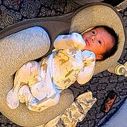 Xavier joined the competition — help win amazing prizes! baby, infant, baby_lounger, clothing, onesie, patterned_blanket, baby_bottle, pacifier, bedroom, soft_fabric, newborn, comfort, sleepwear, face, handwear, lying_down, looking_up, cute, home, resting