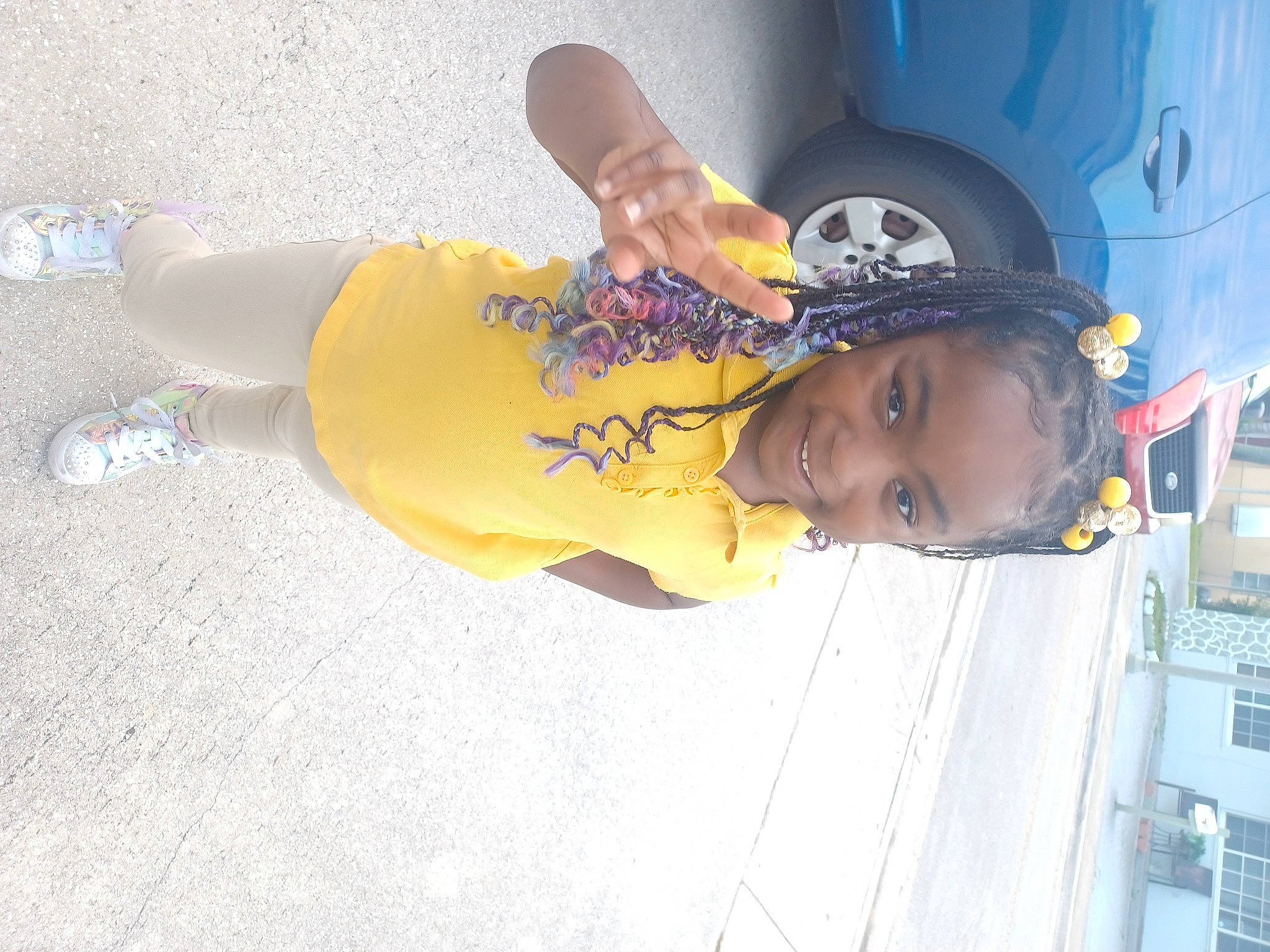 Kai joined the competition — help win amazing prizes! automotive_exterior, automotive_lighting, automotive_tire, car, child, electric_blue, family_car, fun, hat, headgear, human_leg, joy, person, rim, smile, thigh, tire, toddler, vacation, vehicle