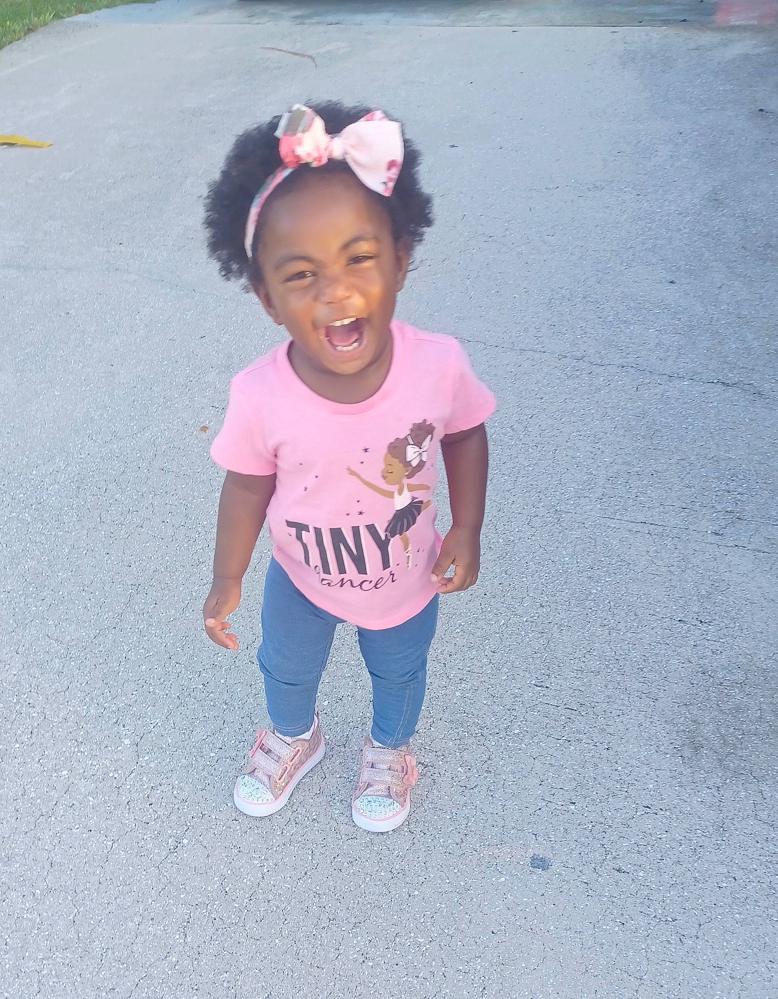 Kenzie joined the competition — help win amazing prizes! asphalt, baby_toddler_clothing, child, electric_blue, fashion_accessory, fun, grass, happy, hat, leisure, magenta, person, pink, play, recreation, road_surface, sleeve, smile, t_shirt, toddler