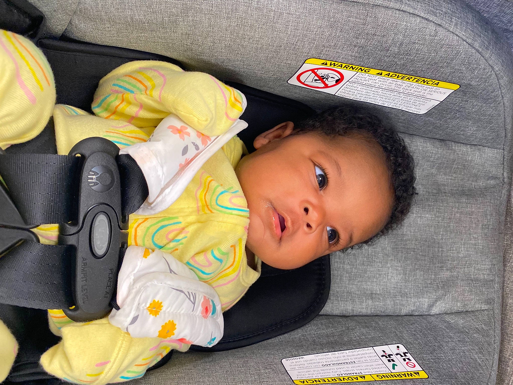 Harlem is registered to the contest to win money with this photo: auto_part, baby, baby_carriage, baby_in_car_seat, baby_products, baby_safety, baby_toddler_clothing, baby_toys, bag, car_seat, carmine, cheek, child, comfort, grass, person, product, sitting, sleep, textile