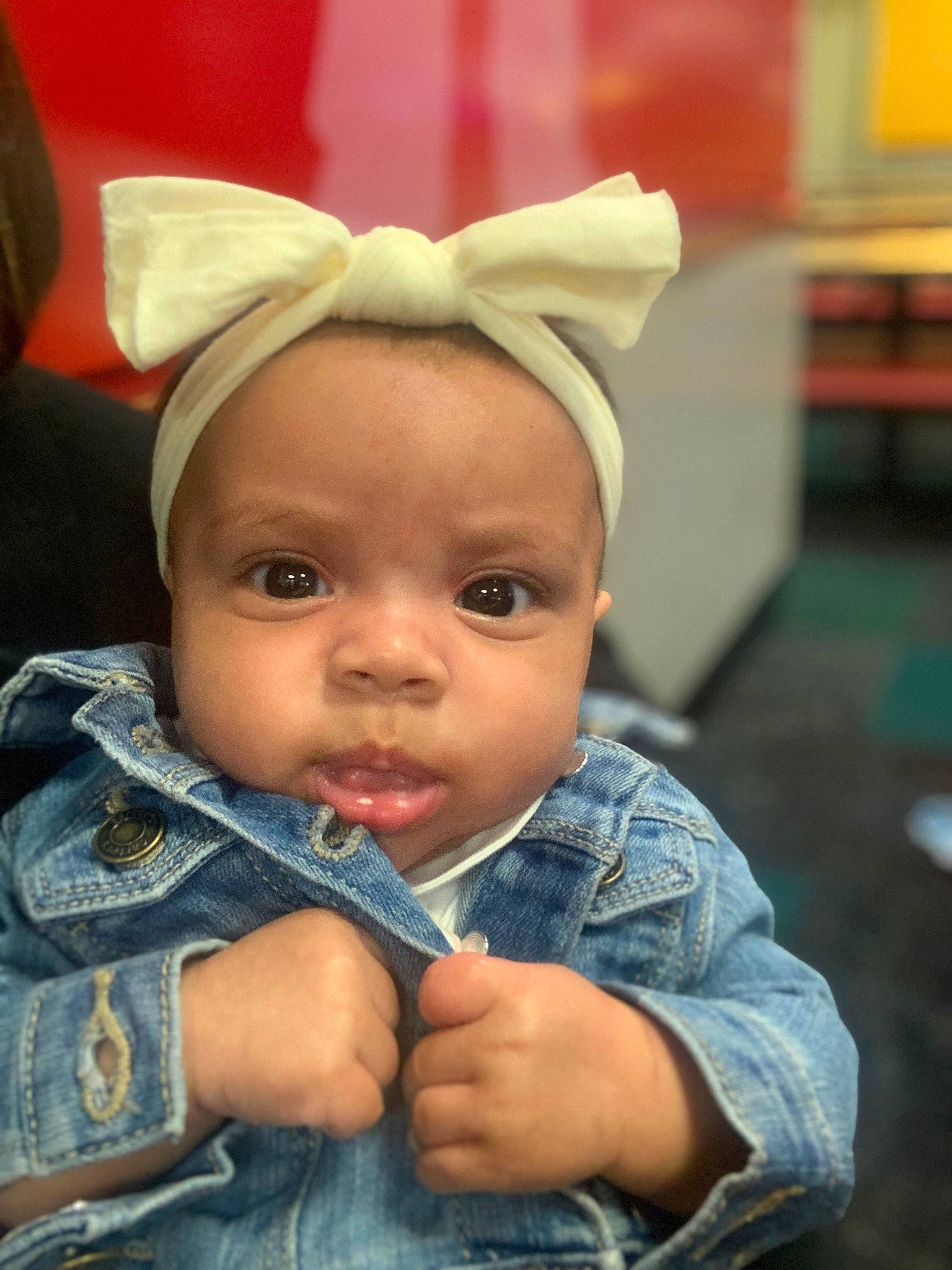 Kamilah joined the competition — help win amazing prizes! baby, cap, cheek, child, chin, clothing, denim, ear, eye, fashion_accessory, fun, happy, headgear, lip, nose, person, portrait_photography, sitting, skin, smile