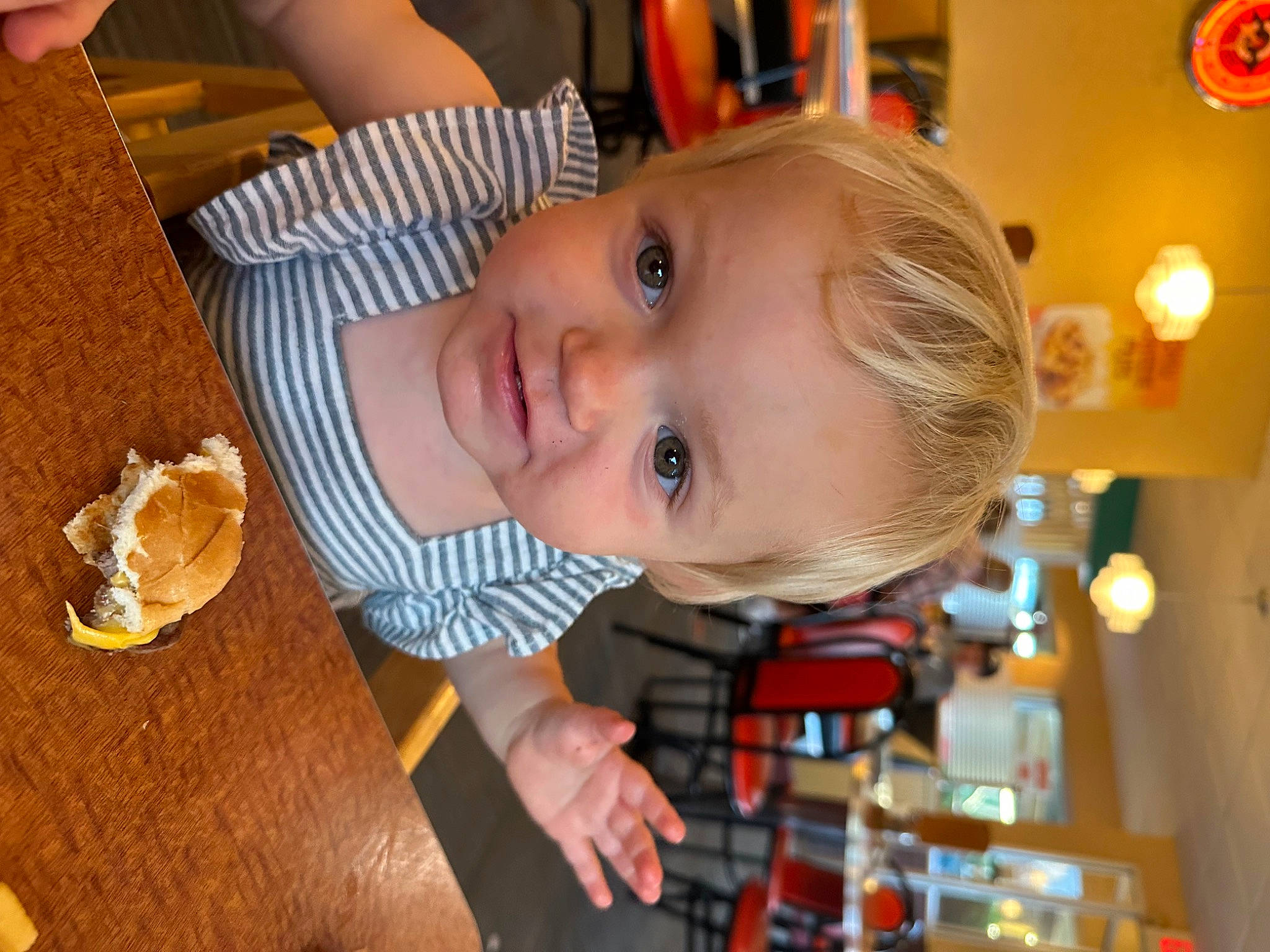 Violette is registered to the contest to win money with this photo: baby, baking, chair, cheek, child, comfort_food, eating, event, food, fun, happy, ingredient, orange, party, person, room, smile, table, tableware, toddler