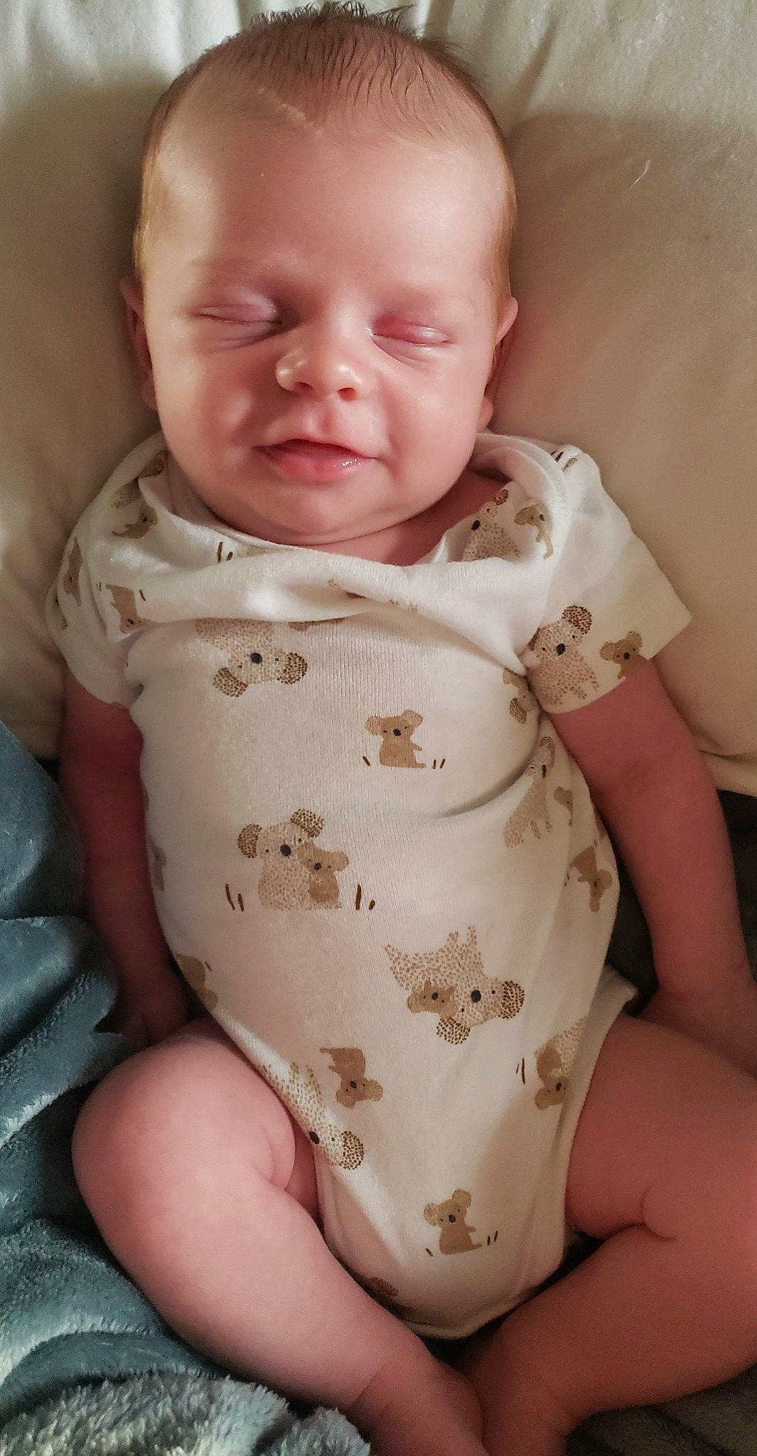 Liam is registered to the contest to win money with this photo: baby, baby_toddler_clothing, cheek, chest, child, collar, comfort, eye, face, head, human_body, iris, linens, lip, person, pink, skin, sleeve, stomach, thumb