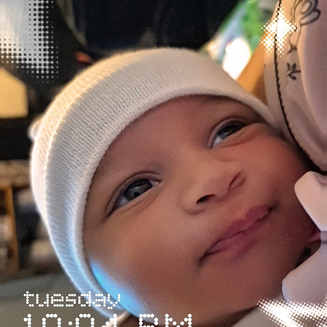 Harlow joined the competition — help win amazing prizes! baby, infant, face, smile, hat, knit_cap, blanket, polka_dots, closeup, portrait, child, cute, indoors, soft_light, star_overlay, timestamp, wrapped, expressive_eyes, cozy, warm
