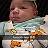 Harlow is registered to the contest to win money with this photo: baby, infant, headband, bow, tiger_print, clothing, cute, portrait, face, expression, lying_down, black_background, heart_doodle, text_overlay, child, newborn, apparel, buttoned_shirt, closeup, adorable