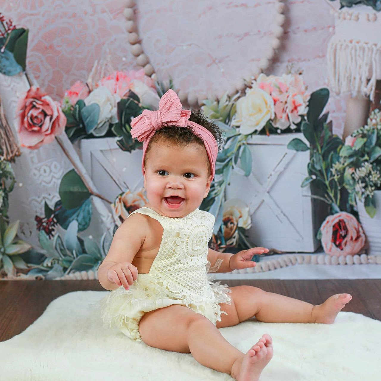 Marliyah-Raine joined the competition — help win amazing prizes! baby, child, cute, decor, floral_backdrop, flowers, happy, headband, indoor, infant, lace, outfit, pink, plants, portrait, rug, sitting, smiling, soft_texture, wooden_floor