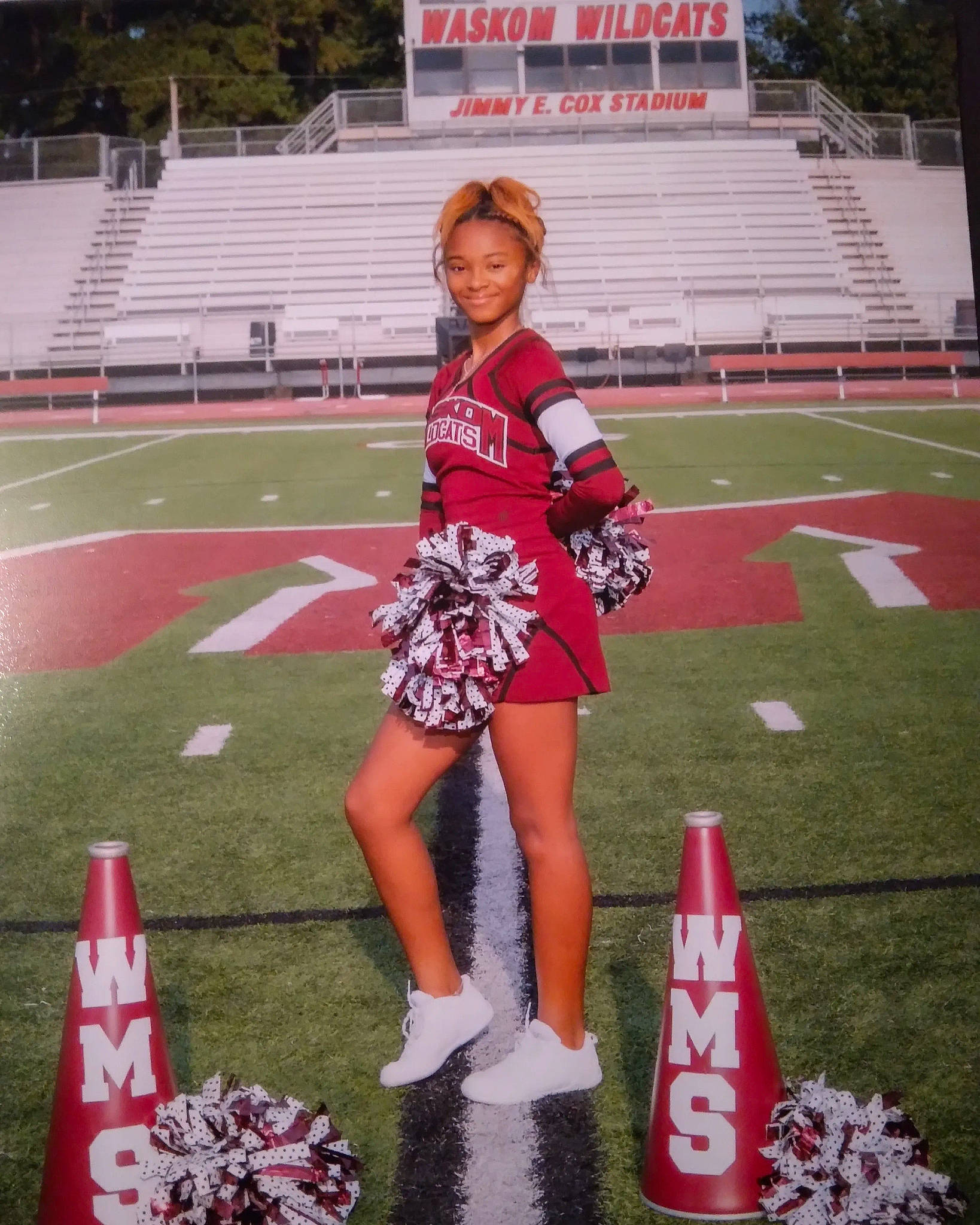 Jada joined the competition — help win amazing prizes! ball_game, championship, cheerleading_uniform, competition_event, grass, human_leg, joy, mammal, person, player, recreation, red, smile, sports, sports_uniform, sportswear, stadium, team, team_sport, thigh