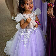 Hélyna participe au concours pour gagner de l'argent avec cette photo : child, girl, dress, lavender, lace, plush_toy, smile, hair_clip, flower_bracelet, person, portrait, outdoor, happy, cute, fashion, celebration, people, event, tulle, holding