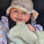 baby, infant, face, hat, clothing, blanket, child, cute, portrait, closeup, expression, blue_eyes, soft, fluffy, cozy, car_seat, young, skin, hand, person