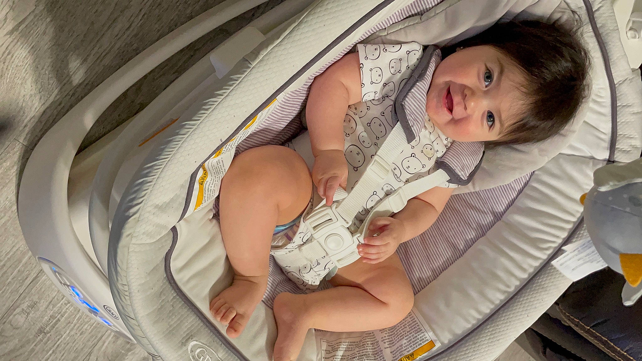 Avelina is registered to the contest to win money with this photo: arm, auto_part, automotive_design, baby, baby_carriage, baby_products, car_seat, comfort, hand, happy, human_body, human_leg, leg, mouth, nail, pattern, person, skin, smile, thigh