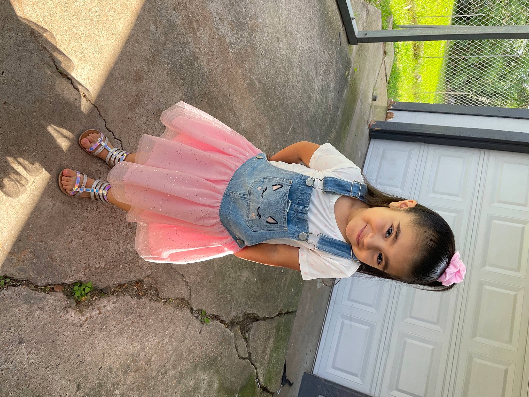 Katalina is registered to the contest to win money with this photo: asphalt, concrete, denim, door, fun, grass, happy, hat, house, human_leg, joy, leisure, person, plant, road_surface, smile, street_fashion, toddler, travel, tree