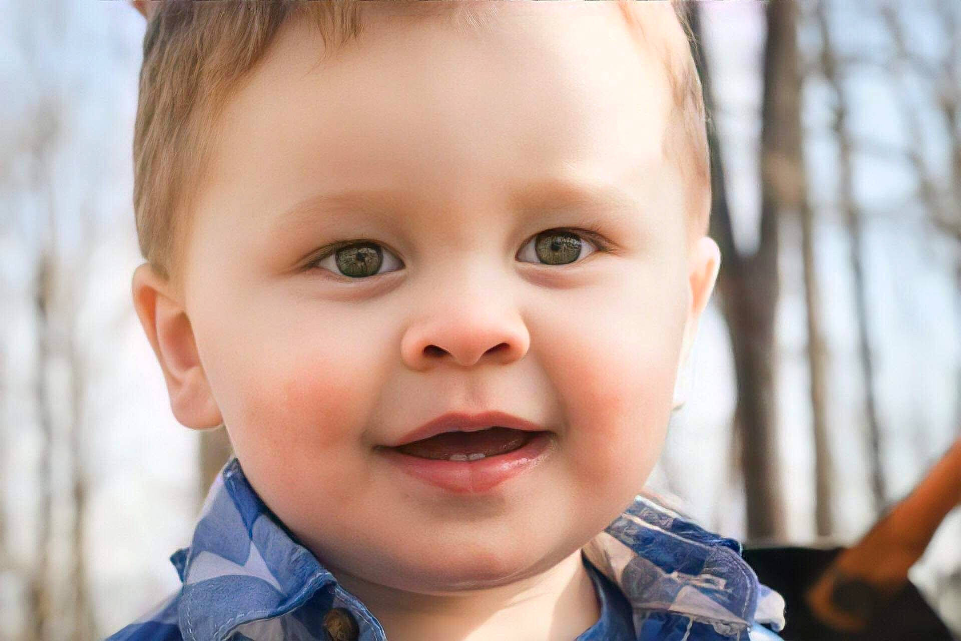 Timothy is registered to the contest to win money with this photo: baby, baby_toddler_clothing, cheek, child, chin, close_up, eyebrow, eyelash, flash_photography, grass, happy, iris, joy, lip, nose, organ, person, skin, sky, smile