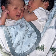 Christophermaximus is registered to the contest to win money with this photo: newborn, baby, sleeping, blanket, twin, infant, cute, soft, cozy, resting, child, family, warm, snuggled, peaceful, wrapped, head, face, white_clothing, indoors