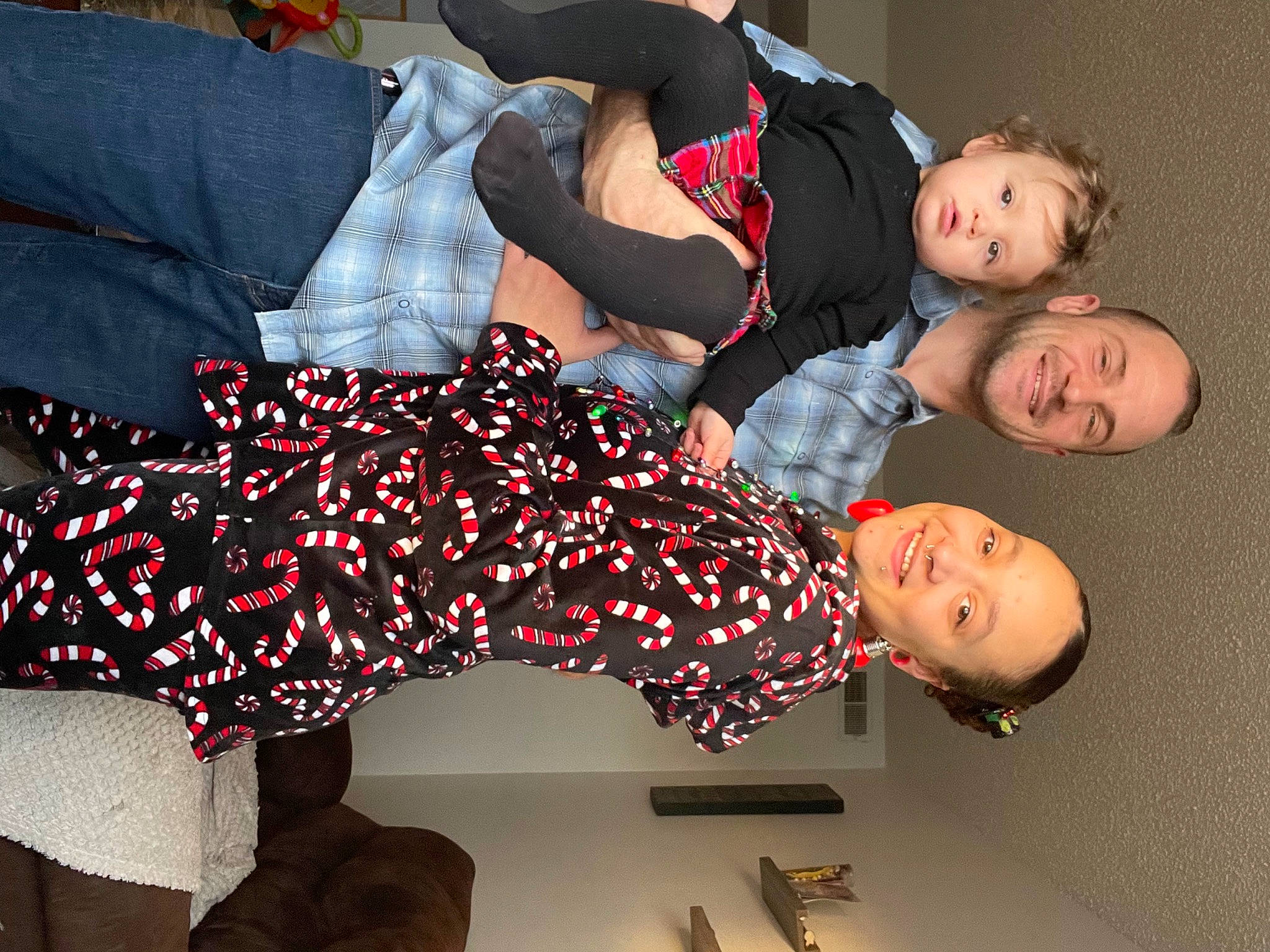 Ebony is registered to the contest to win money with this photo: black_hair, carmine, comfort, design, event, face, fashion, fashion_design, flash_photography, fun, happy, human_leg, joy, linens, pattern, person, plaid, red, room, sitting