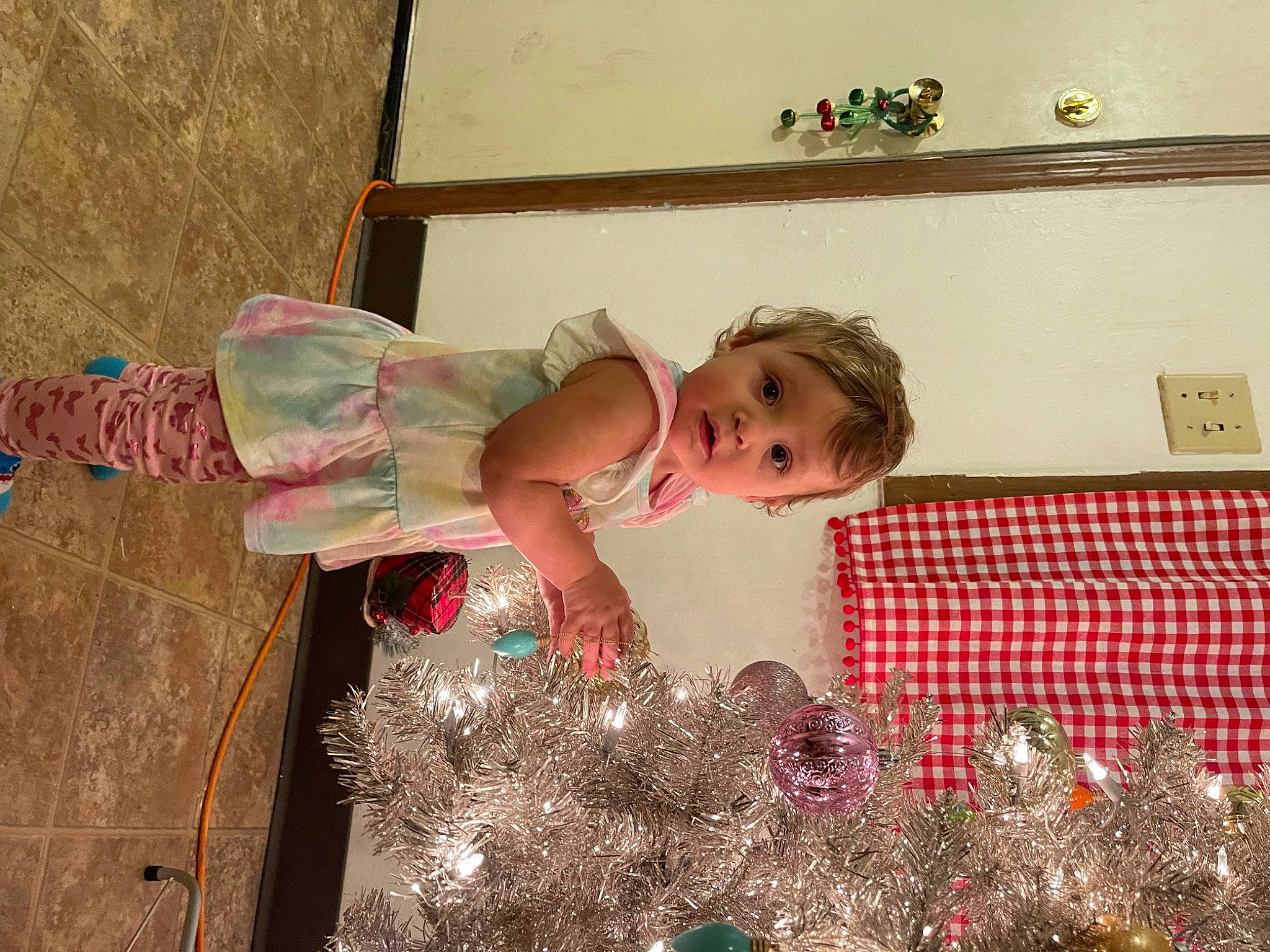 Ebony is registered to the contest to win money with this photo: baby, child, event, flooring, fun, holiday, leisure, magenta, pattern, person, pink, play, room, surprise, toddler, tree