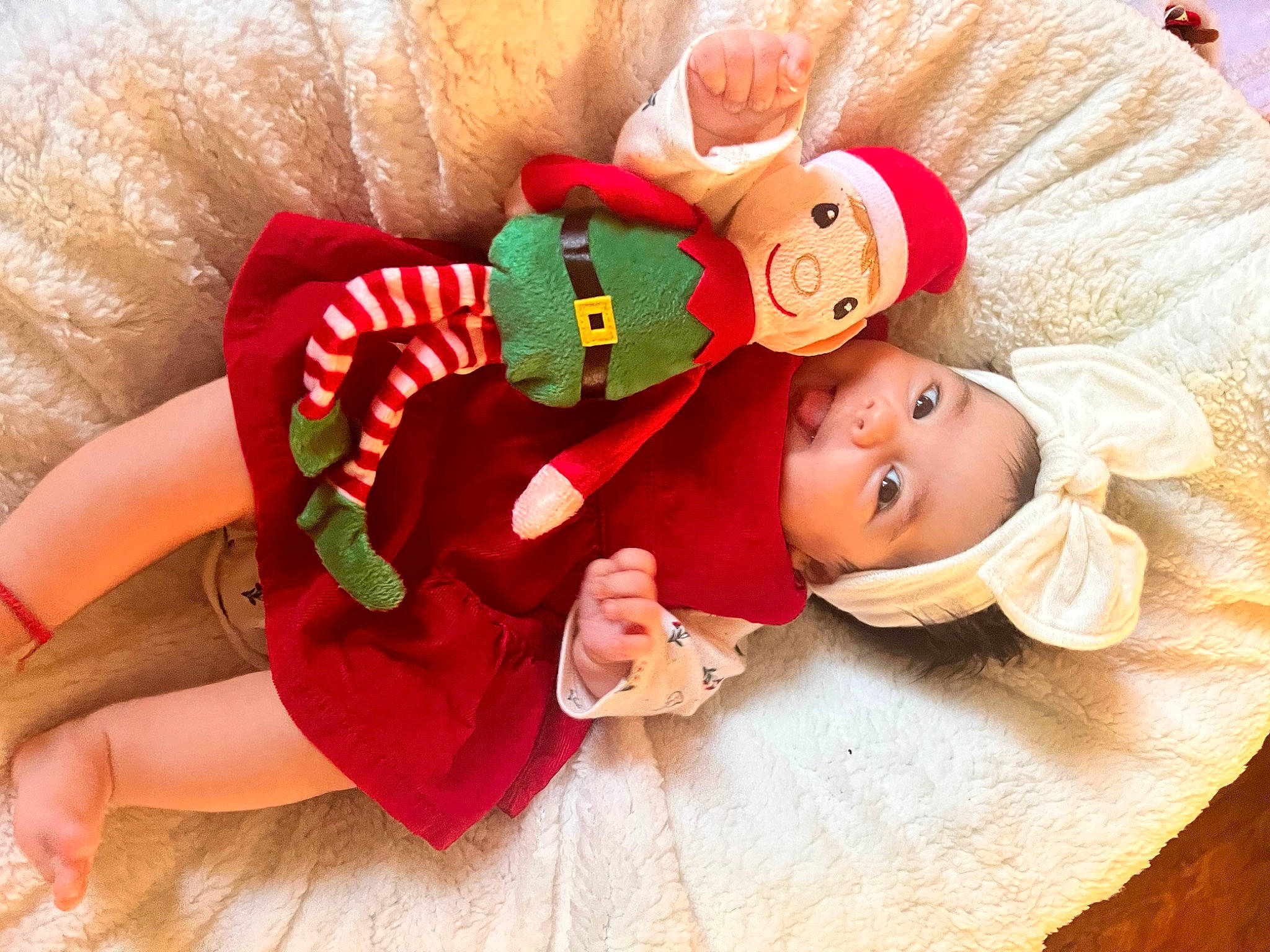 Katalina joined the competition — help win amazing prizes! baby, baby_sleeping, baby_toddler_clothing, christmas, comfort, doll, event, fictional_character, happy, hat, headgear, headwear, human_leg, lap, linens, orange, person, pink, santa_claus, thigh