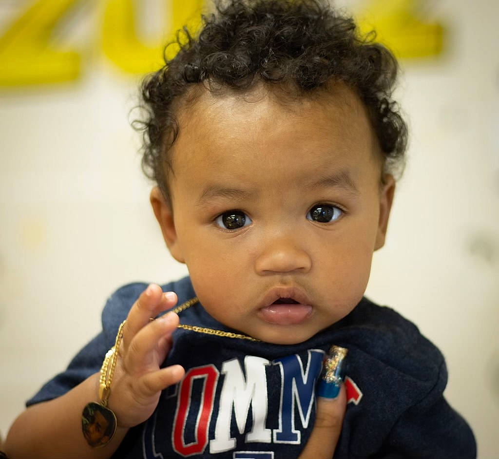 Dreyon is registered to the contest to win money with this photo: baby_toddler_clothing, cheek, chin, ear, eyebrow, eyelash, forehead, gesture, hair, happy, iris, lip, neck, nose, person, skin, sleeve, t_shirt, toddler, watch