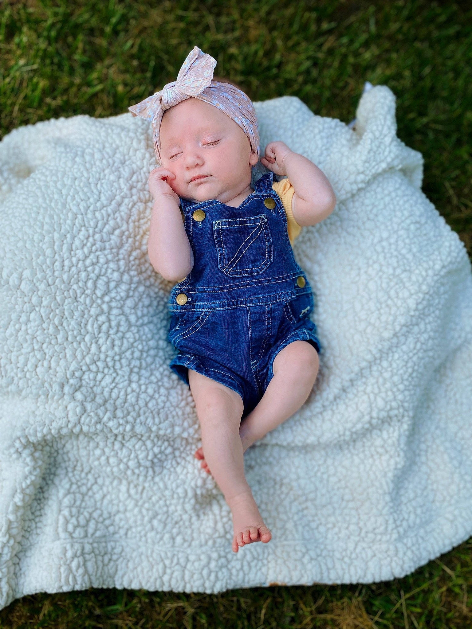 Raegan is registered to the contest to win money with this photo: art, baby, baby_toddler_clothing, child, dress, electric_blue, embellishment, fashion_accessory, grass, headgear, headpiece, headwear, pattern, people_in_nature, person, portrait_photography, sitting, skin, sleeve, textile