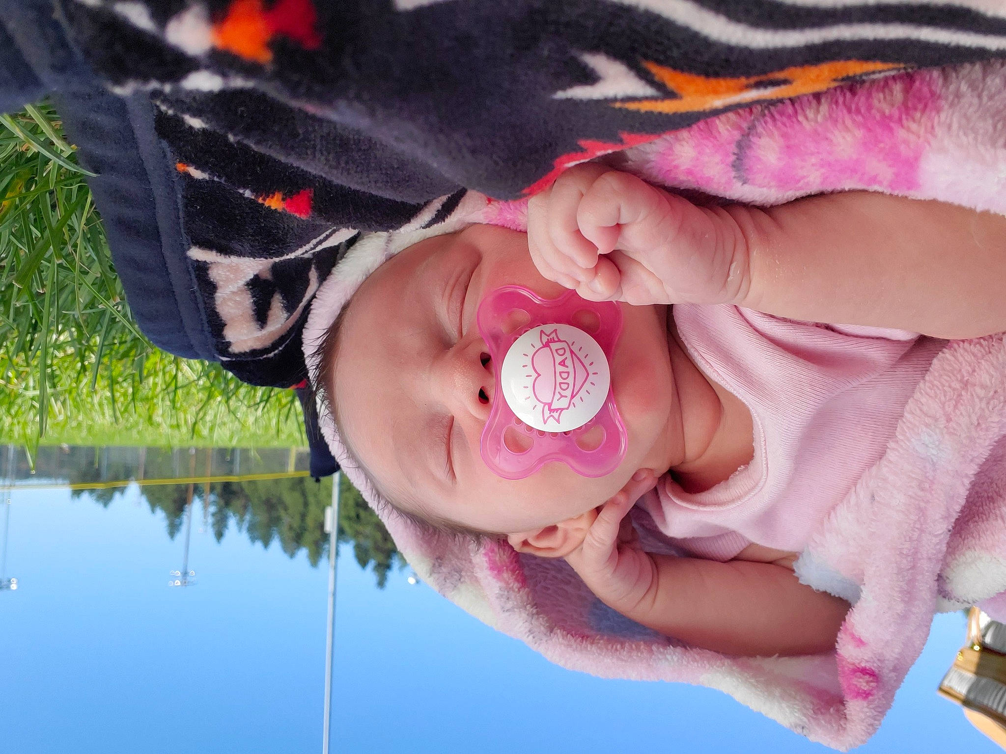 Gianna is registered to the contest to win money with this photo: baby, beauty, cheek, child, cool, eye, grass, hand, happy, head, headgear, lip, mouth, nose, person, photography, pink, skin, smile, tree
