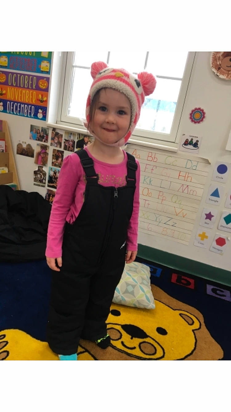 Mikeyla is registered to the contest to win money with this photo: child, costume, headband, joy, person, pink, play, room, sleeve, smile, t_shirt, toddler
