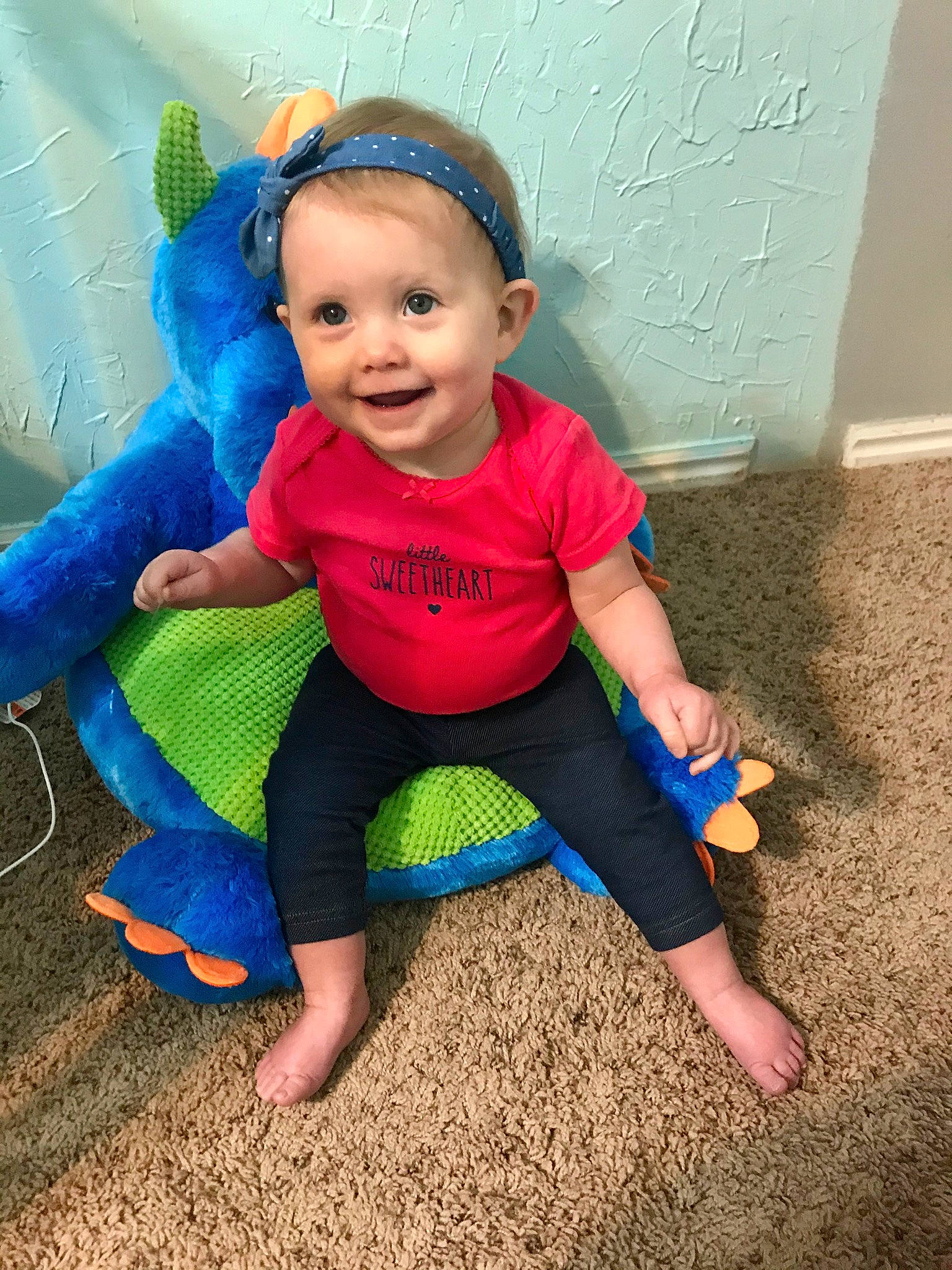 Avalon is registered to the contest to win money with this photo: baby, baby_toddler_clothing, blue, child, eye, face, fun, happy, head, joy, person, play, product, sitting, skin, smile, toddler, vacation