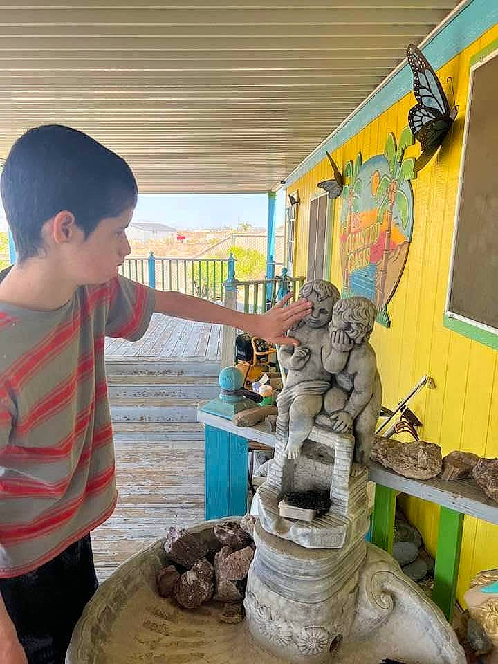 Kenneth is registered to the contest to win money with this photo: art, artifact, baseball_cap, cap, child, fun, hat, leisure, machine, person, pottery, room, sculpture, shorts, statue, t_shirt, temple, toddler, tourism, visual_arts