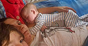 Thor is registered to the contest to win money with this photo: architecture, baby, bed, bedroom, blanket, building, couch, cushion, face, furniture, head, homedecor, indoors, newborn, person, photography, portrait, quilt, room, sleeping
