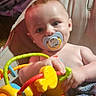 Thor is registered to the contest to win money with this photo: baby, blanket, bodypart, clothing, couch, face, finger, furniture, hand, happy, head, homedecor, newborn, person, photography, portrait, rattle, smile, t_shirt, toy