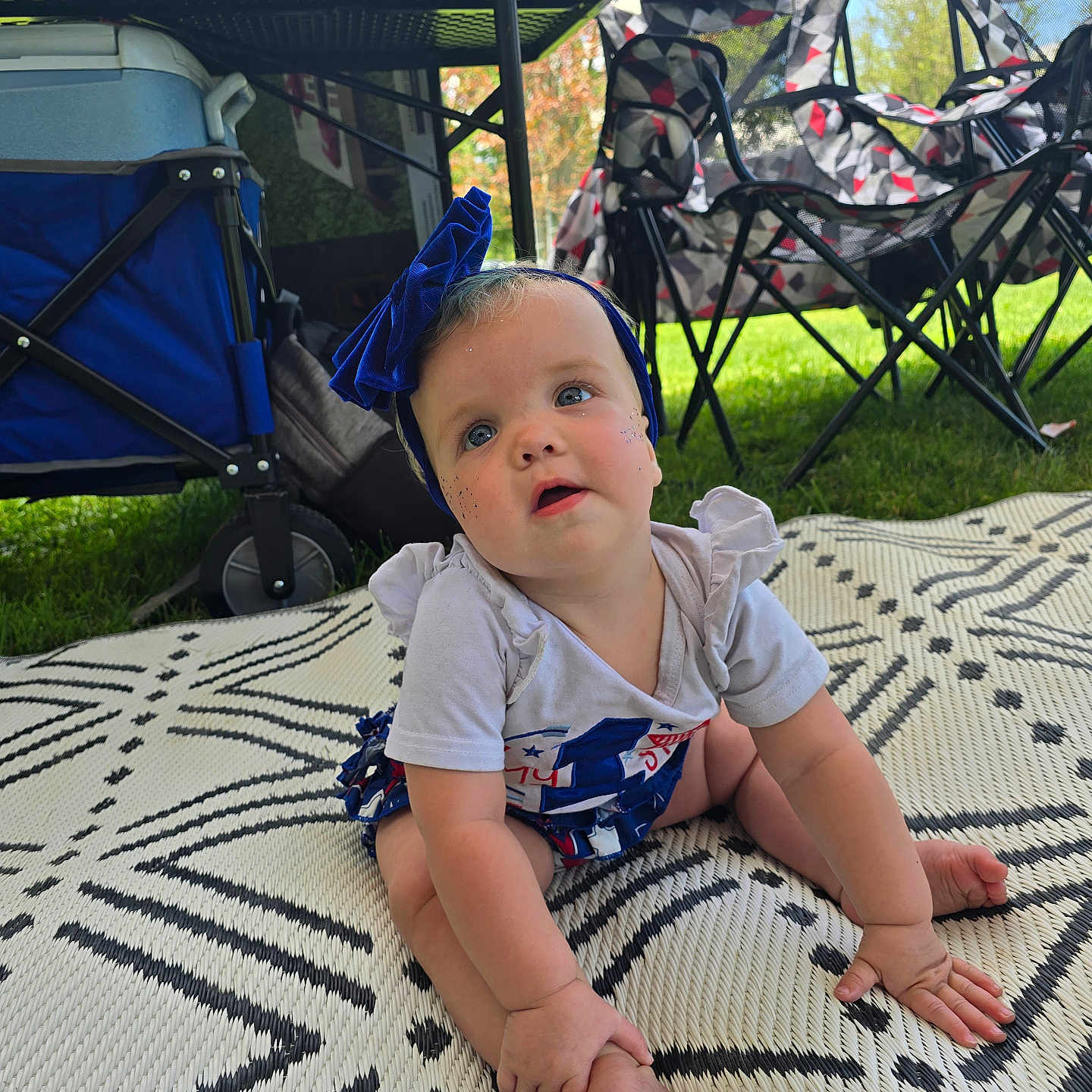 Braelynn is registered to the contest to win money with this photo: architecture, baby, backyard, building, chair, face, furniture, grass, head, nature, outdoors, park, person, photography, plant, portrait, shelter, sitting, summer, yard