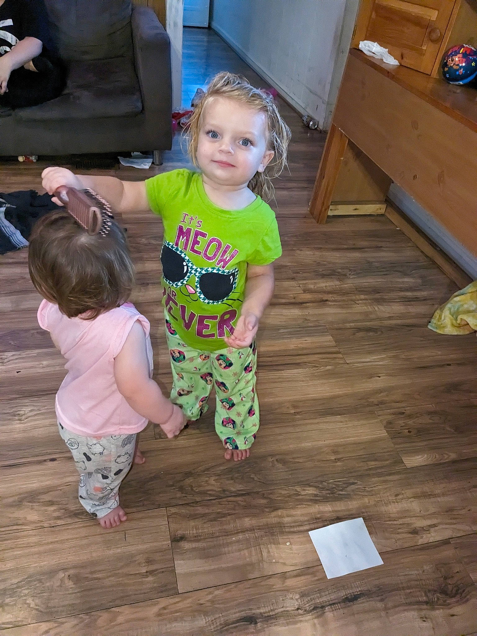 Mia is registered to the contest to win money with this photo: baby_toddler_clothing, child, event, floor, flooring, fun, happy, hardwood, joy, laminate_flooring, person, plank, room, sitting, skin, sleeve, t_shirt, toddler, varnish, wood