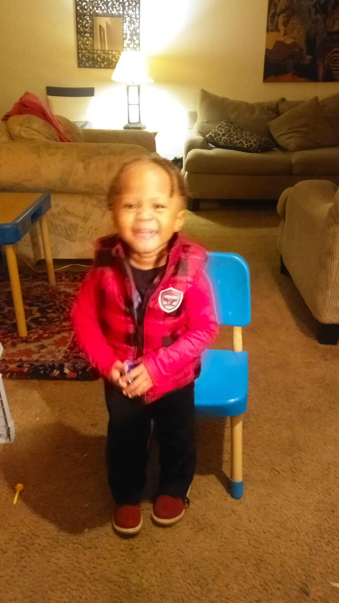 Franklin is registered to the contest to win money with this photo: blue, chair, child, day, flooring, fun, furniture, girl, human_body, joy, organ, person, play, product, red, room, sitting, snapshot, standing, toddler