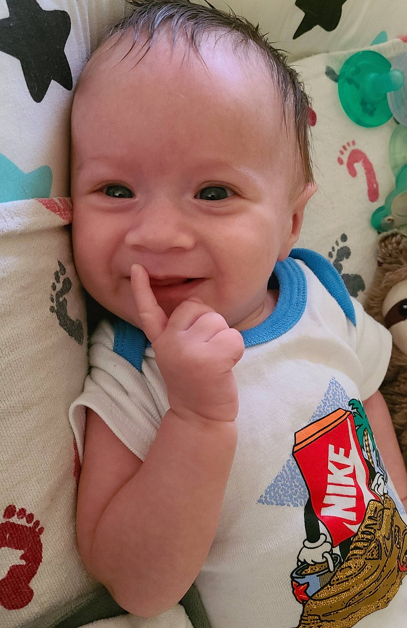 Kaeden is registered to the contest to win money with this photo: baby, baby_toddler_clothing, cheek, chin, facial_expression, finger, gesture, green, happy, head, iris, joy, lip, mouth, nose, person, pink, skin, sleeve, smile