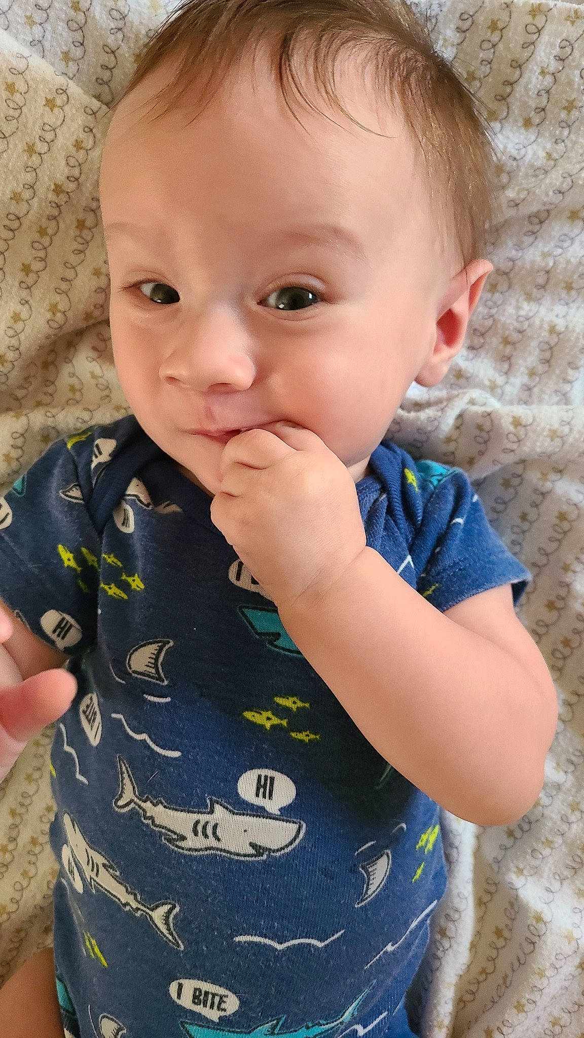 Kaeden is registered to the contest to win money with this photo: arm, azure, baby_toddler_clothing, cheek, chin, clothing, facial_expression, hand, happy, human_body, iris, lip, mouth, neck, nose, person, product, skin, sleeve, smile