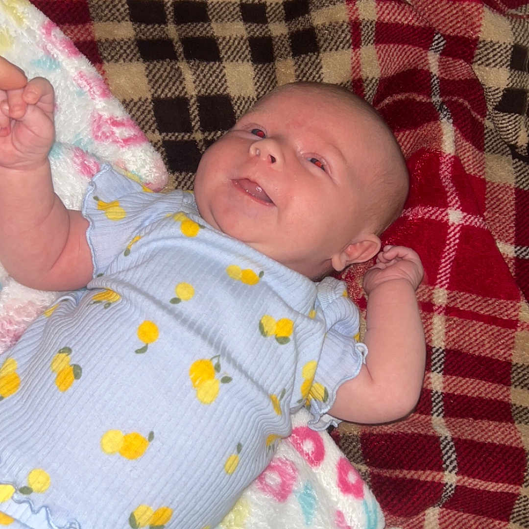 Layla is registered to the contest to win money with this photo: baby, bed, bedroom, blanket, clothing, crib, cushion, face, furniture, glove, head, homedecor, indoors, newborn, person, photography, portrait, quilt, room, sleeping