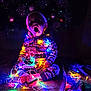 Bowen joined the competition — help win amazing prizes! child, toddler, christmas_lights, pajamas, holiday, decorations, tree, ornaments, indoors, barefoot, colorful, glowing, surprised, festive, sitting, night, celebration, cozy, cute, face