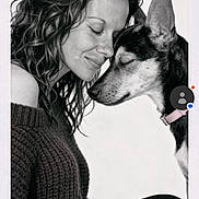 Luna Tuna is registered to the contest to win money with this photo: affection, black_and_white, canine, close_up, closed_eyes, collar, cuddle, curly_hair, dog, indoor, long_hair, nose_to_nose, person, pet, photography, pink_collar, portrait, sweater, tender_moment, woman