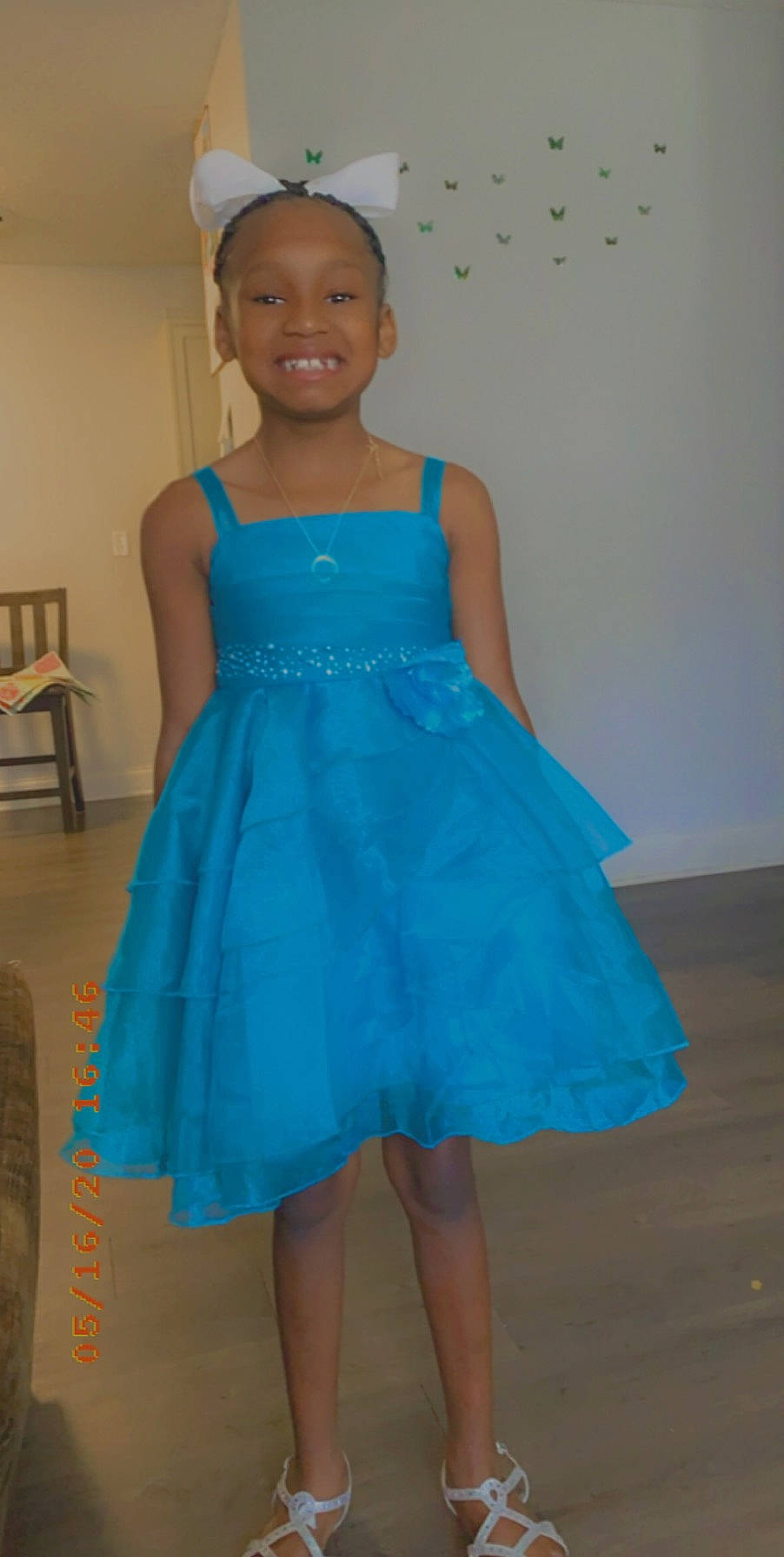 Kimora is registered to the contest to win money with this photo: aqua, azure, blue, cobalt_blue, cocktail_dress, day_dress, dress, electric_blue, embellishment, hair_accessory, headpiece, joy, one_piece_garment, pattern, person, ruffle, shelf, shoulder, standing, teal