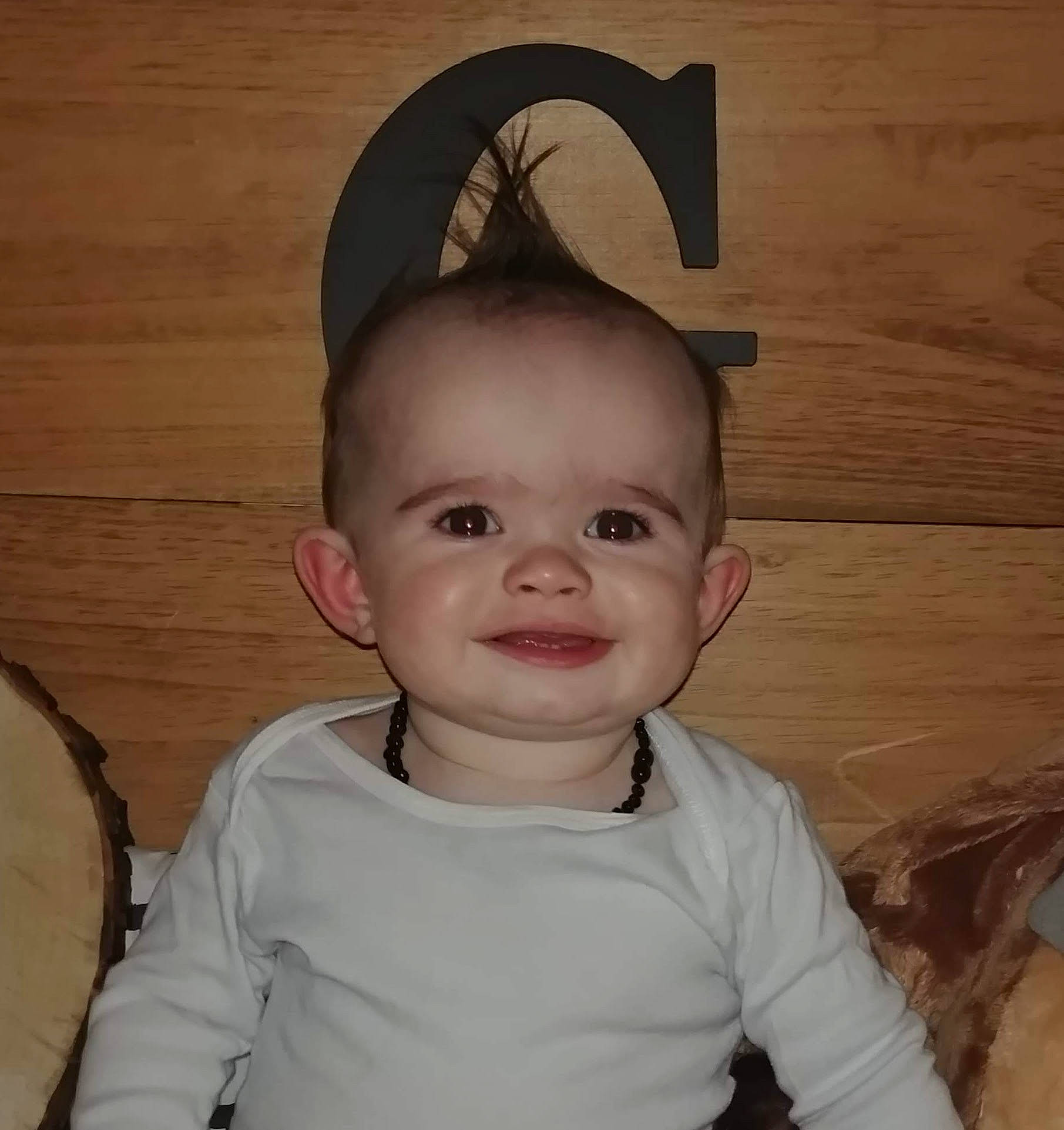 Gannon is registered to the contest to win money with this photo: baby, cheek, child, costume_accessory, ear, face, fashion_accessory, hair_accessory, hat, head, headgear, joy, person, smile, toddler