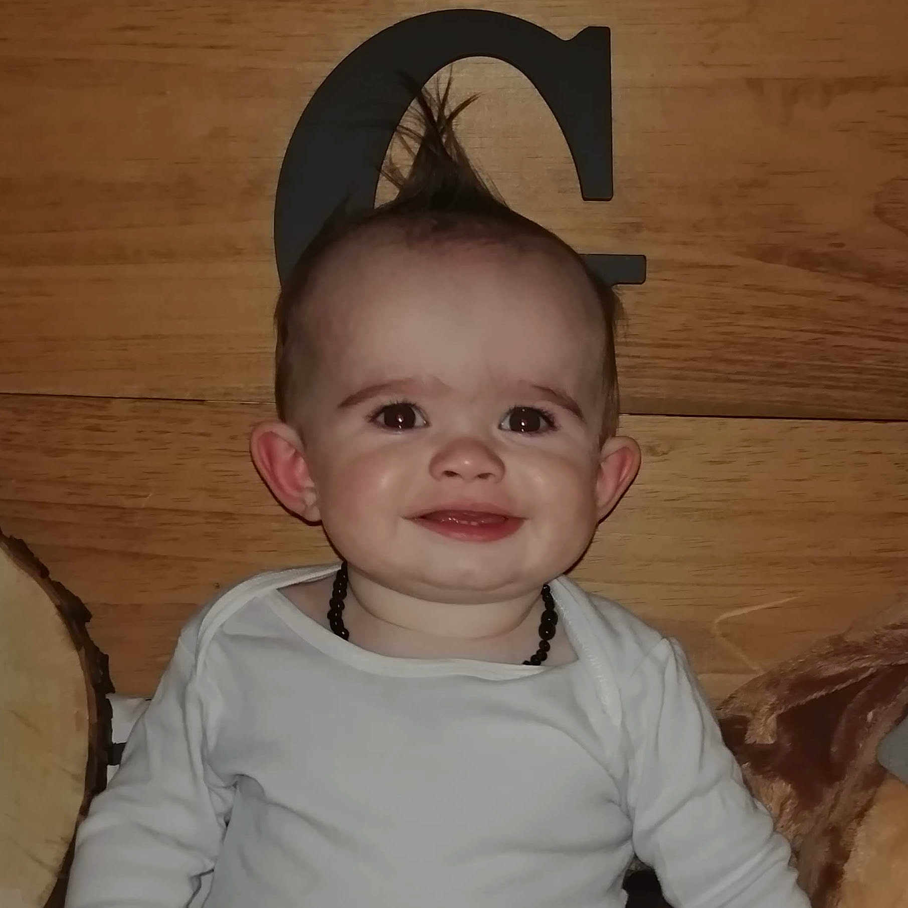 Gannon is registered to the contest to win money with this photo: baby, cheek, child, costume_accessory, ear, face, fashion_accessory, hair_accessory, hat, head, headgear, joy, person, smile, toddler