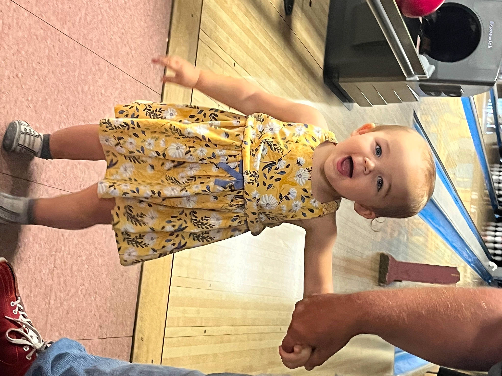 Alaya is registered to the contest to win money with this photo: abdomen, baby, child, facial_expression, fashion_design, flooring, fun, happy, home_appliance, human_leg, knee, leisure, pattern, person, room, sitting, thigh, toddler, waist, wood