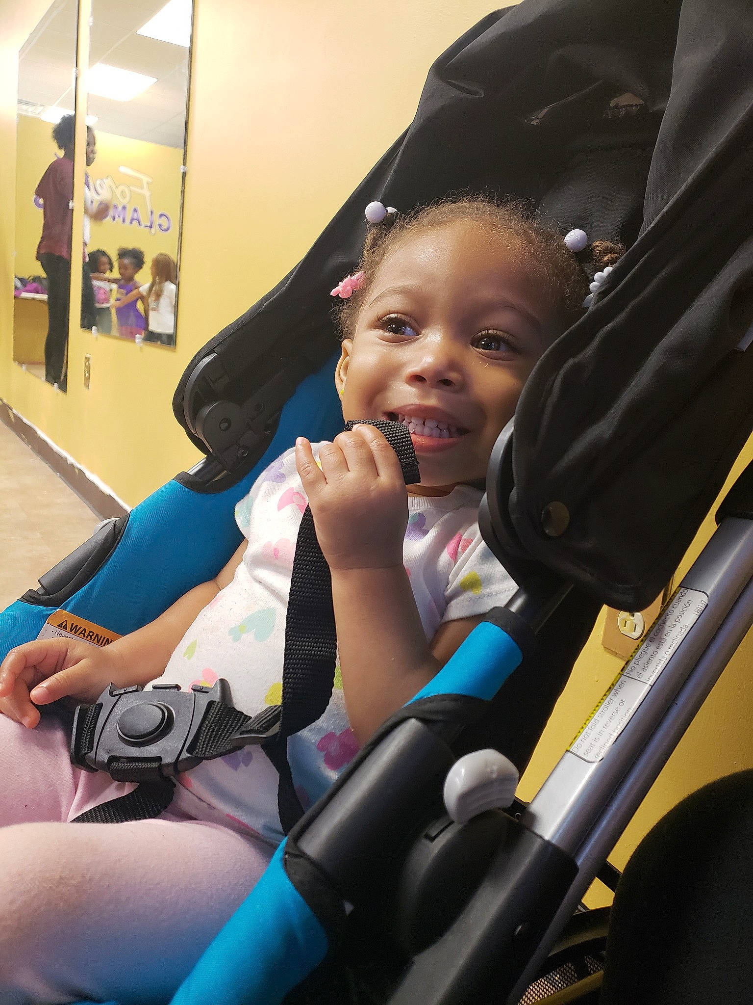 Harmonie is registered to the contest to win money with this photo: baby, baby_carriage, baby_products, car_seat, child, head, leg, leisure, person, product, sitting, skin, smile, toddler, vacation