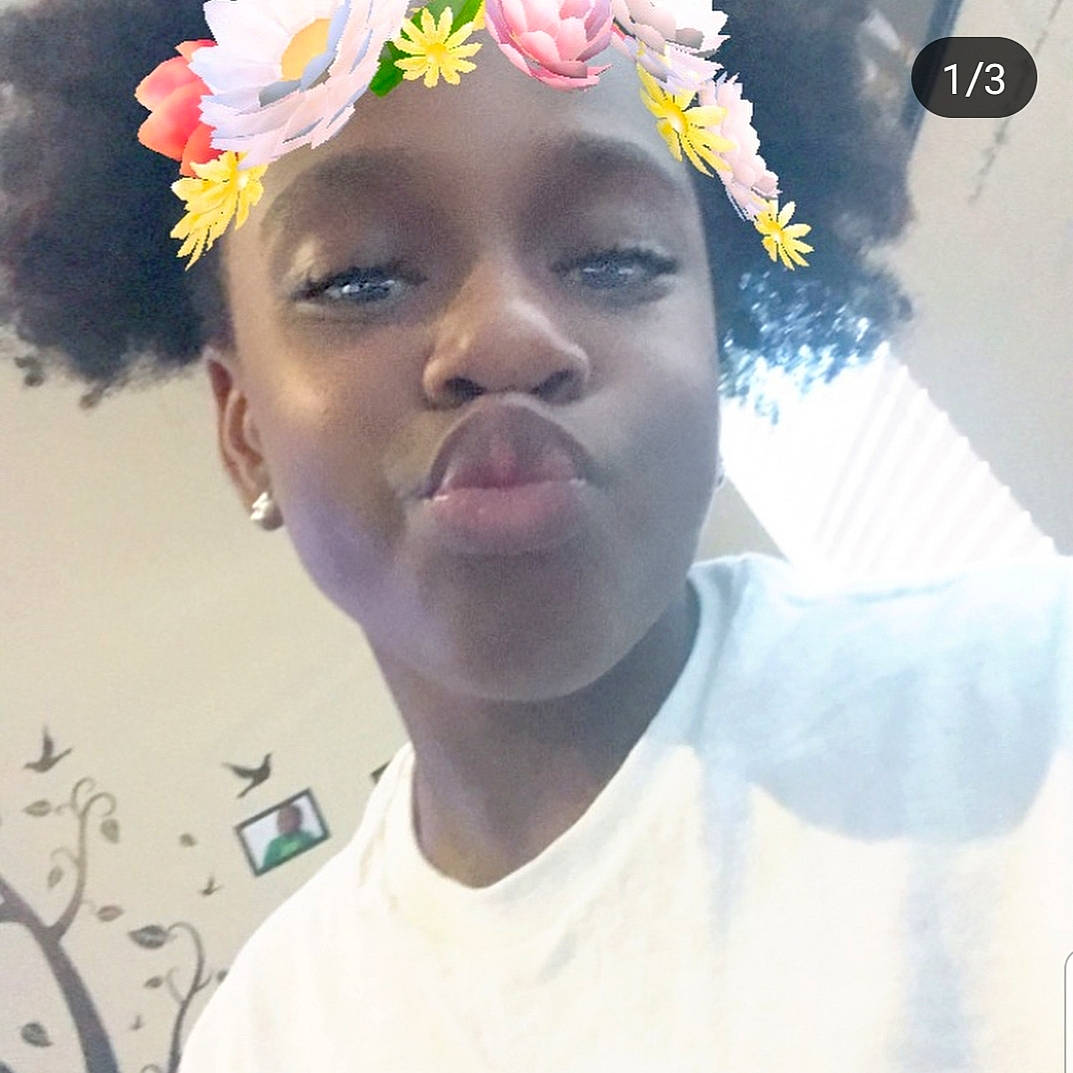 Nakia is registered to the contest to win money with this photo: beauty, black_hair, cheek, child, chin, cool, face, flower, forehead, hair, hair_accessory, hairstyle, head, headgear, headpiece, nose, person, photography, selfie, skin