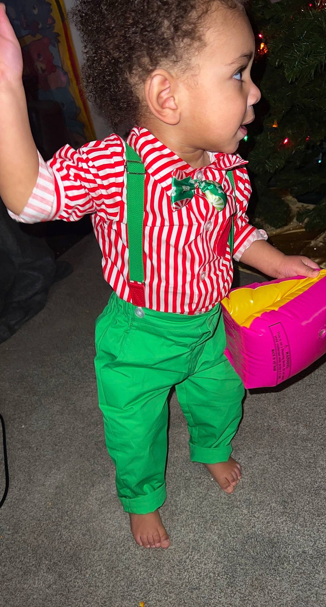 Jaivyn is registered to the contest to win money with this photo: active_pants, baby, baby_toddler_clothing, child, event, face, fun, happy, head, magenta, pajamas, pattern, person, play, shoe, sleeve, sportswear, sweatpant, t_shirt, tie