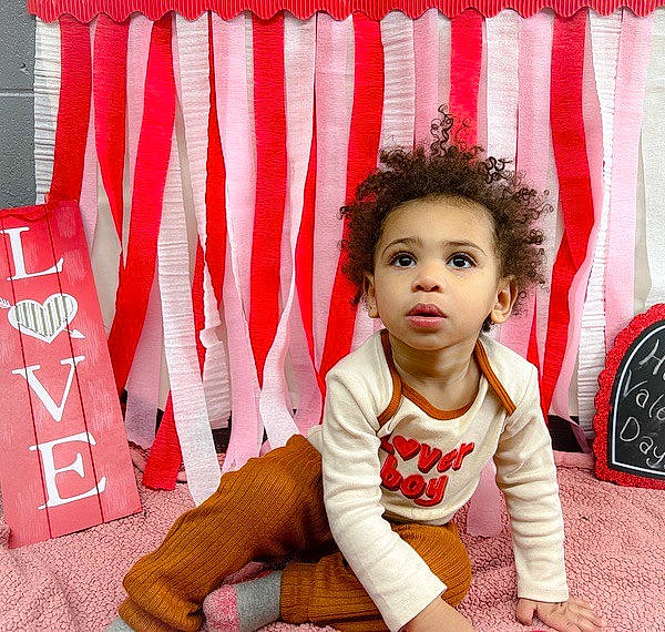 Jaivyn is registered to the contest to win money with this photo: baby_toddler_clothing, beauty, carmine, child, chin, event, facial_expression, fashion, flag_of_the_united_states, flooring, fun, happy, pattern, person, red, sitting, sleeve, textile, thigh, toddler