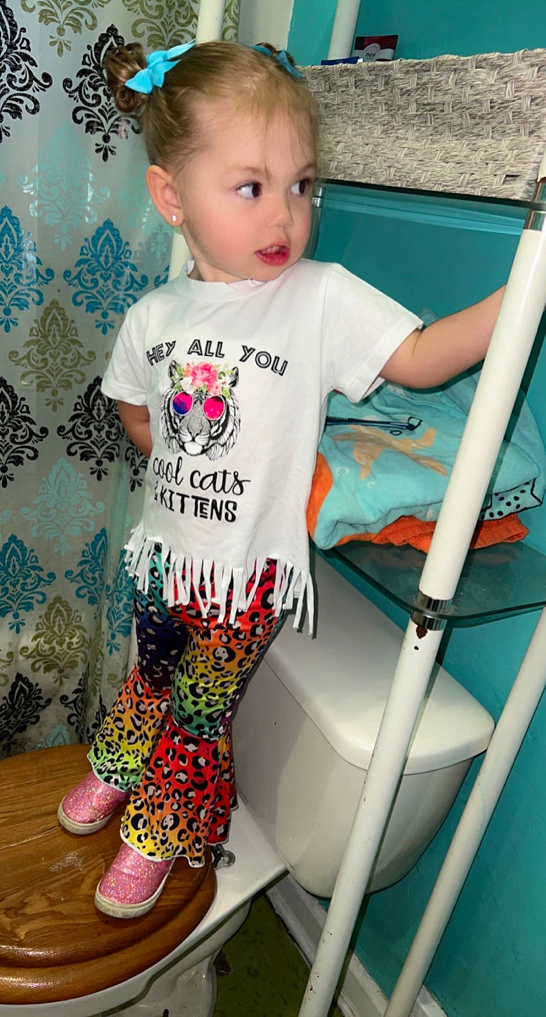 Nova is registered to the contest to win money with this photo: baby_toddler_clothing, beauty, child, cool, face, facial_expression, hairstyle, happy, head, human_leg, knee, person, skin, sleeve, sportswear, t_shirt, thigh, toddler, waist, white